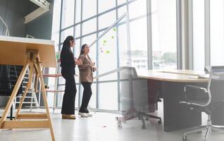 Teamwork and Brainstorming Concept with Businesswomen in Office Meeting, Creative Business Meeting with Women Discussing Ideas in Office Space photo