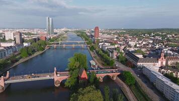 Aerial view of Frankfurt, Germany, showing the Main River, European Central Bank, historic bridges, urban architecture, and motion on the bridges. video