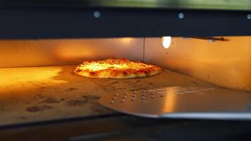 Pizza in oven. Baking pizza. The chef is turning hot pizza with a spatula in a stove. Process of cooking pizza in pizzeria. Tasty cookery. video