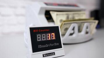 Electronic device showing the amount of money. Equipment for counting money. Money are counted in a calculating machine. Automatic equipment for banking financial transactions. video