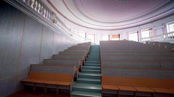 Modern auditorium with stairs. Many rows of wooden desks rising up in the conference hall. Spacious classroom for lectures in the university. video