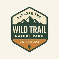 Explore Nature Park Emblem with Mountain Graphic and Outdoor Theme vector
