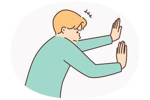 Man tensely pushes invisible wall with hands or sets himself goal of opening secret passage vector