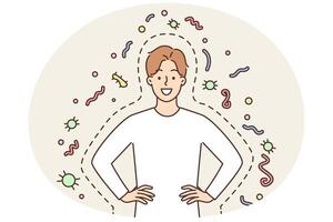 Happy man with good immunity smiling and holding hands on belt standing among bacteria and parasites vector