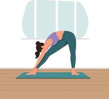 Woman practicing yoga in triangle pose on mat with natural light indoors vector