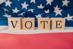 Wooden block with the word Vote written on it photo