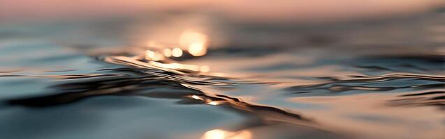 Gentle waves reflect soft light at sunset over water photo