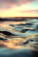 Gentle water ripples reflect the evening light photo
