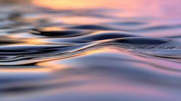 Calm ripples of water reflect the colorful sunset hues photo