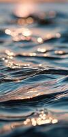 Waves reflecting sunlight on calm water surface photo