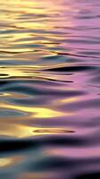 Reflections dancing on calm water during sunset glow photo