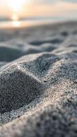 A close up of sand on the beach at sunset photo