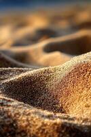 A close up of a sand dune with a bird flying in the air photo