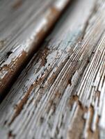 Peeling paint on a textured rustic wood surface photo