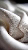 Soft linen fabric with gentle folds creating a textured appearance photo