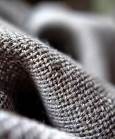 Close-up of textured gray fabric with intricate weaving photo