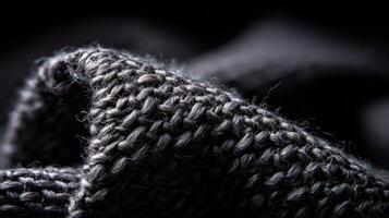 Detailed view of textured black fabric showcasing woven patterns photo