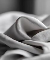 Soft gray fabric drapes beautifully in a warm setting photo