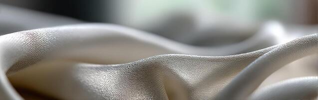 Elegant fabric draped gracefully on a surface with soft lighting photo