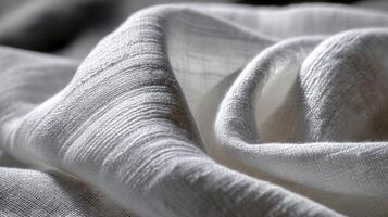 Soft white fabric draping creates an elegant textured backdrop photo