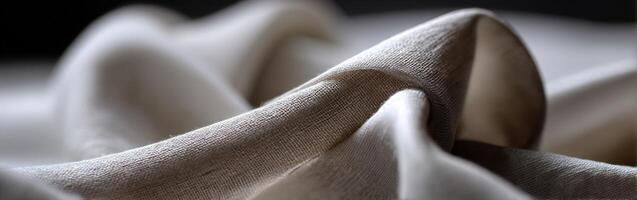 Soft fabric draping elegantly across a surface in natural light photo