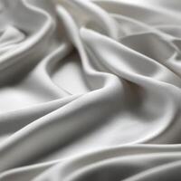 Elegant white fabric draping with soft texture and smooth finish photo
