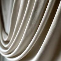 Soft fabric draping elegantly against natural light in a cozy setting photo