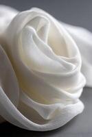 Soft white fabric folded like a delicate rose photo
