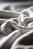 Soft fabric texture showcasing gentle folds and waves photo