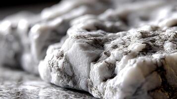 A close up of a rock with some white and black photo