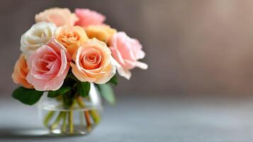 Bouquet of colorful roses in glass vase on table photo