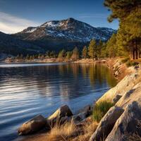 Calm lake reflecting a mountain at sunset photo