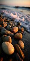 Vibrant pebbles on a tranquil shore at sunset photo