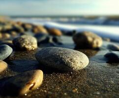 Rocks on the beach by the ocean photo