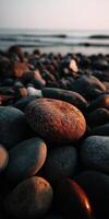 Stones scattered on the shore during sunset photo