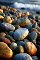 Colorful pebbles along a serene coastal shore photo