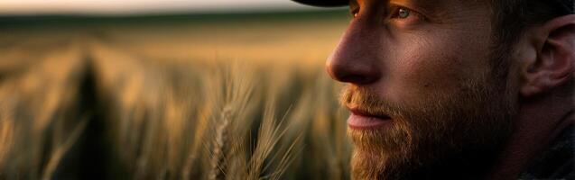 A man in a hat is looking off into the distance photo