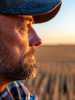 Profile of a man at sunset in a field photo