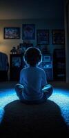 Child enjoys gaming in a cozy dimly lit room photo