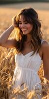 Smiling woman in white dress in wheat field photo
