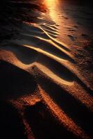 Golden light illuminates textures in sandy landscape photo