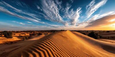 Vast desert landscape with dramatic clouds at sunset photo