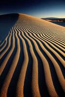 Patterns of wind-sculpted sand at dusk photo