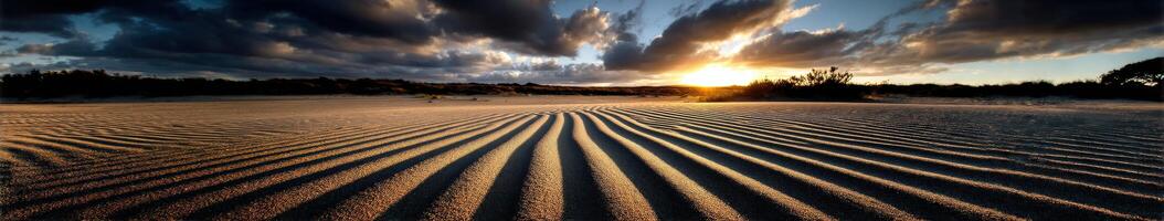Patterns of sand under a sunset sky in the desert photo