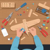 Hands Assembling Wooden Model Airplane with Tools on Workbench Illustration vector