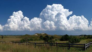 Beautiful cloud formations over grassy hills in nature photo