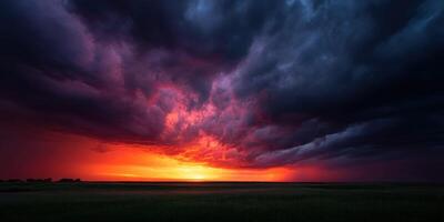 Dramatic sunset over a vast landscape with dark clouds photo