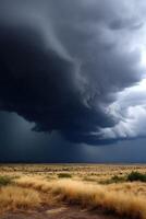 Dark storm clouds gather over a vast prairie landscape photo