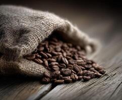 Coffee beans in a sack on a wooden table photo