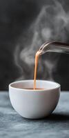 A spoon being poured into a bowl of soup photo